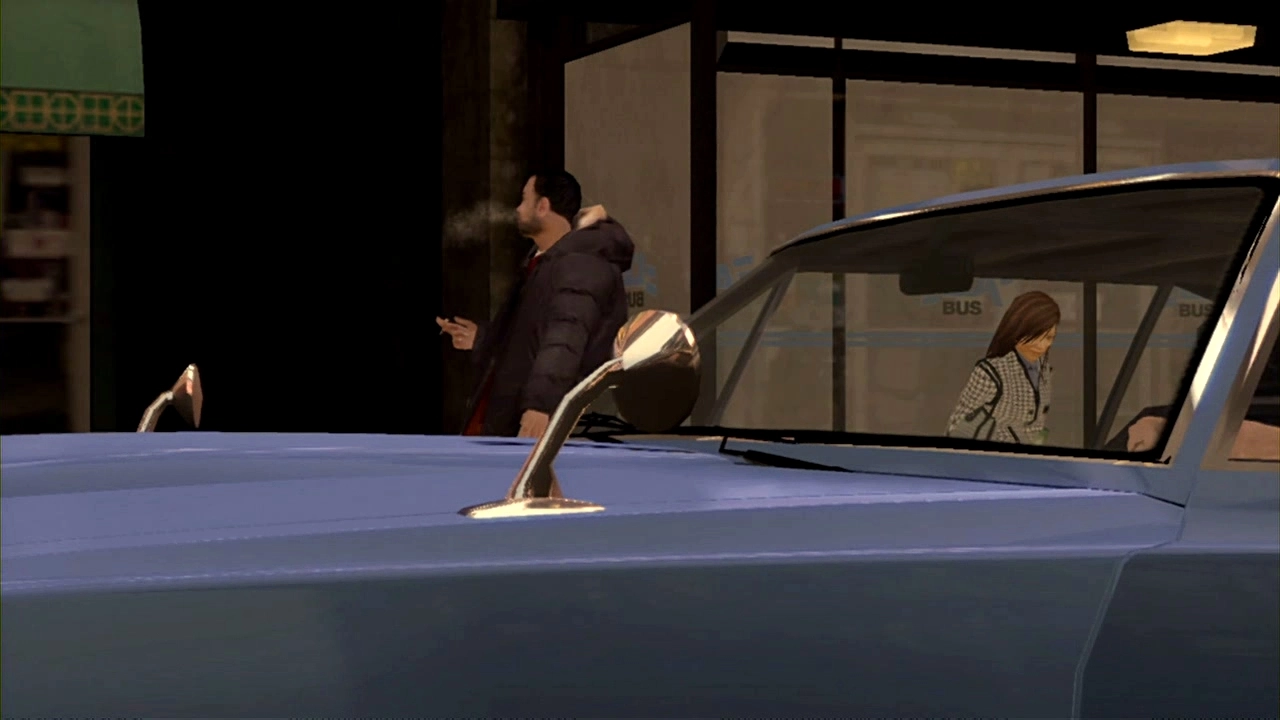 Two pedestrians wait at the bus stop. One is smoking.