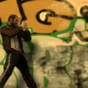 Niko walks along a grafitti covered wall, gun drawn. | Views: 2772