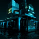 A beautifully lit building on the water at night. | Views: 4303