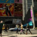 Pedestrians go about their daily activities as a cop car drives past.