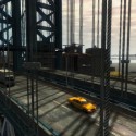 A few vehicles drive across a large bridge. | Views: 2675