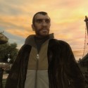 The main character Niko Bellic stands in a park.