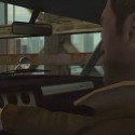 Niko checks his mirrors as he drives across the bridge. | Views: 2705